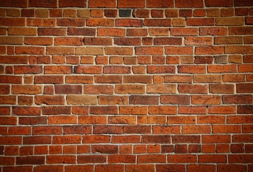 Fototapeta Wyblakły barwiony stary ceglany mur