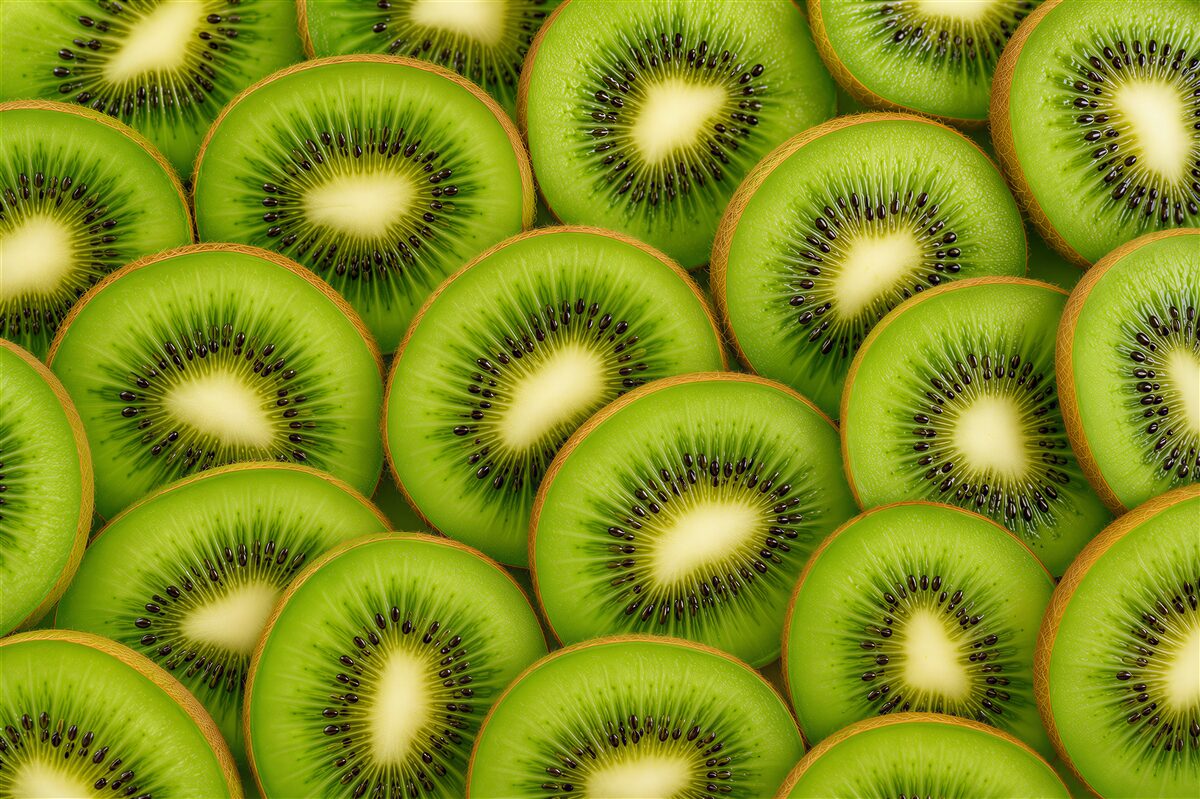 Fototapeta soczyste kiwi i zielone liście do kuchni